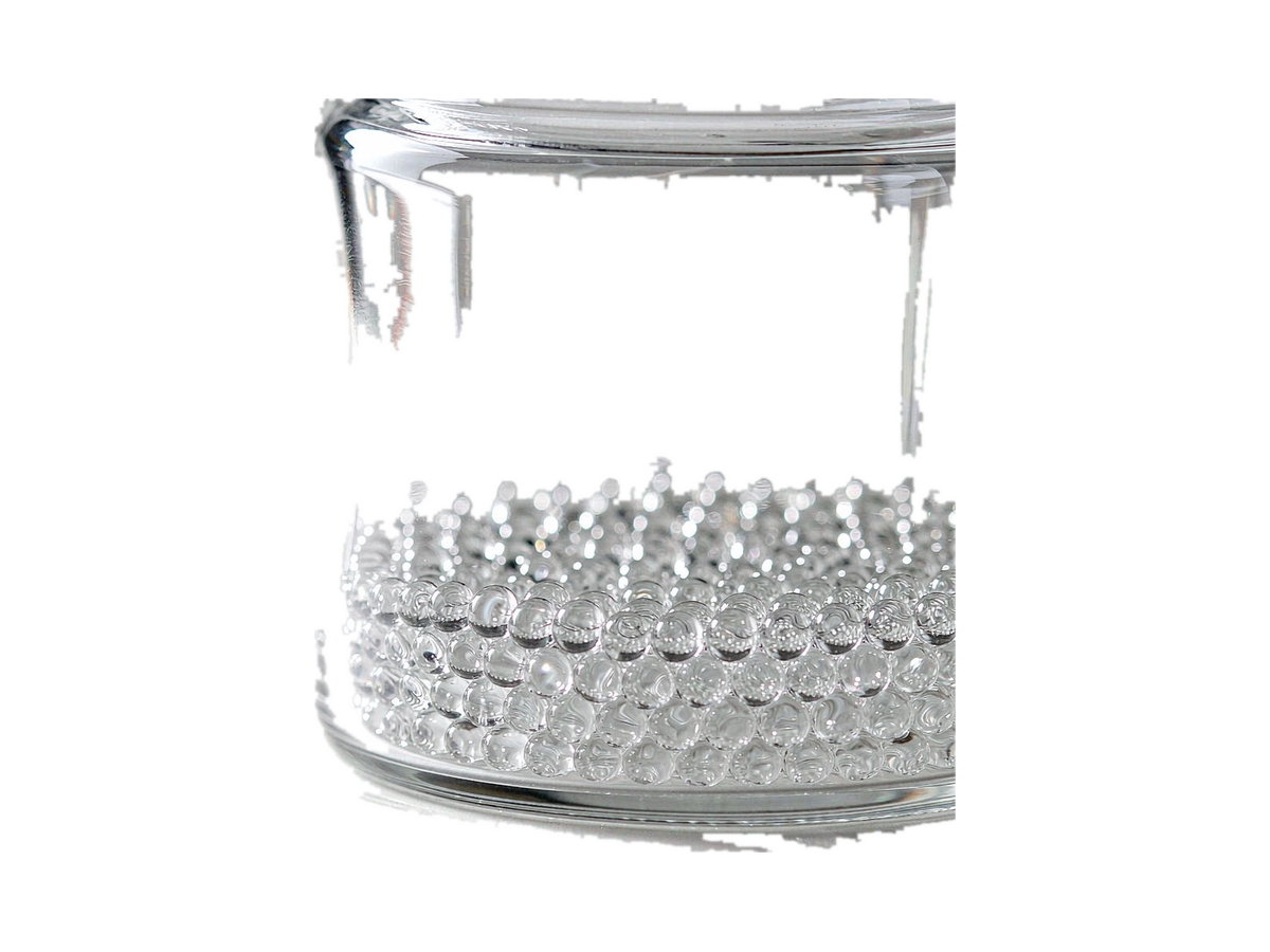 Uniform transparent glass micro-beads filling a clear glass jar